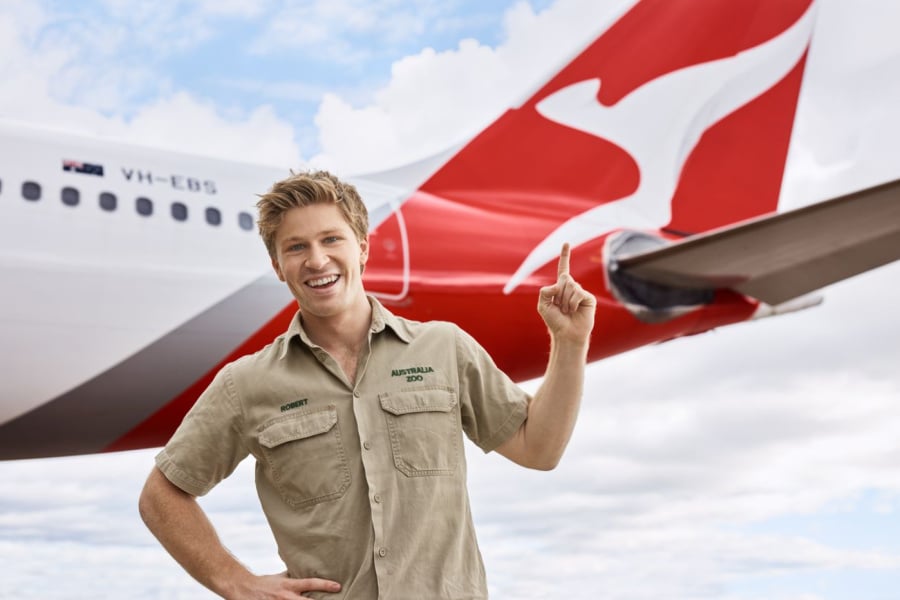 Robert Irwin points at Qantas plane
