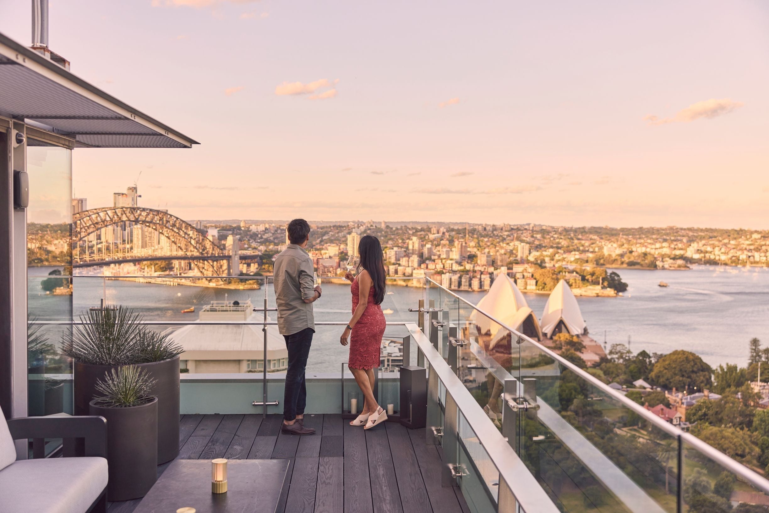 Couple admiring view from rooftop bar