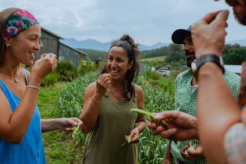 Visitors eating farm produce