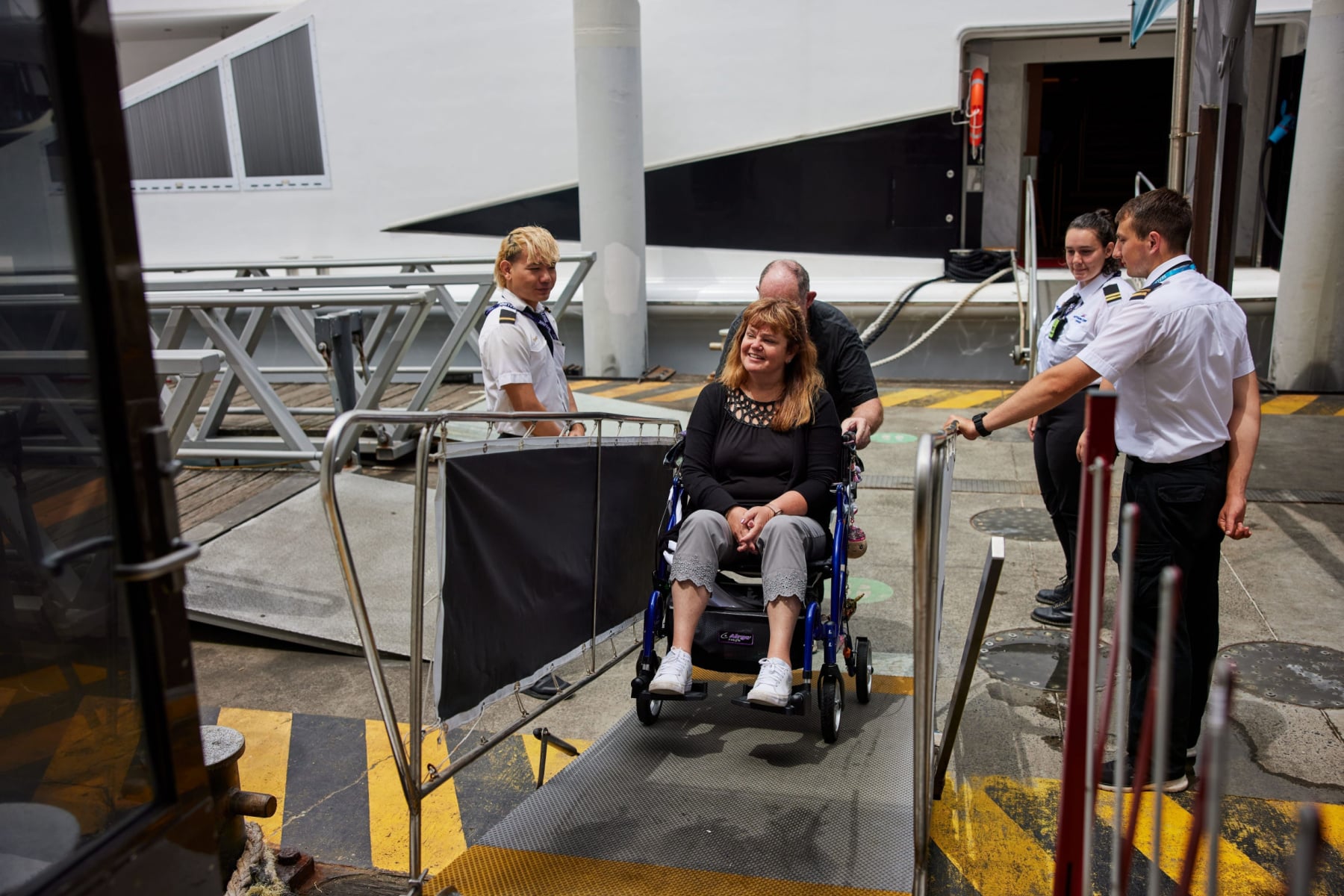 Woman in wheelchair boarding ferry