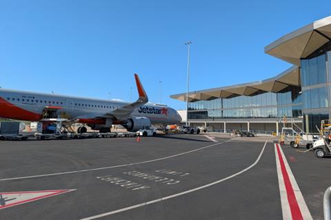 Plane arriving at Newcastle Airport terminal