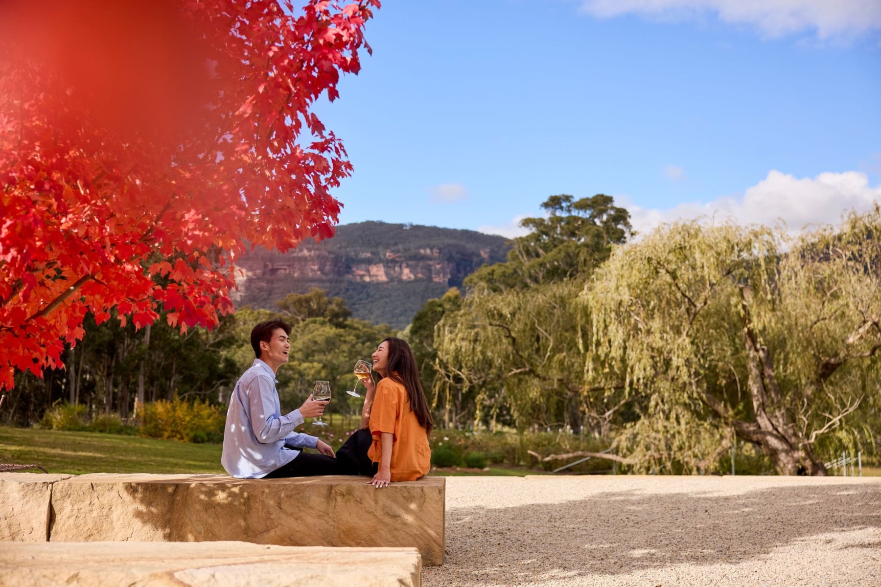 Couple drinking wine in NSW countryside
