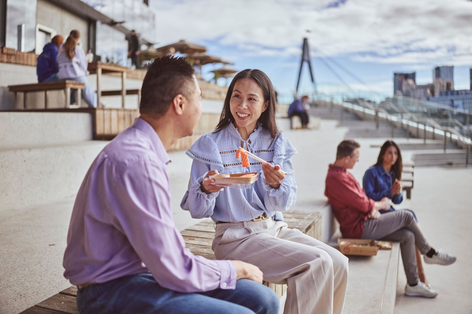 Couple eating sushi at Sydney Fish Market