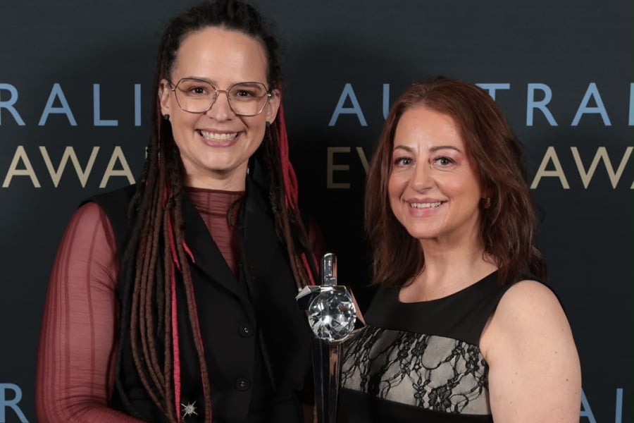Staff members collecting award